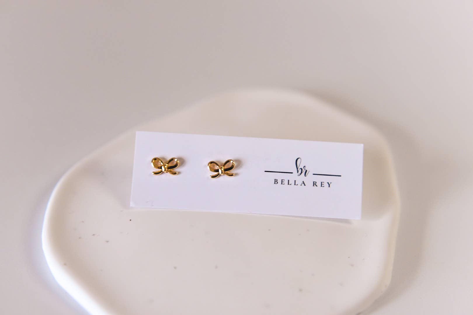 The Lela Dainty Gold Bow Stud Earrings